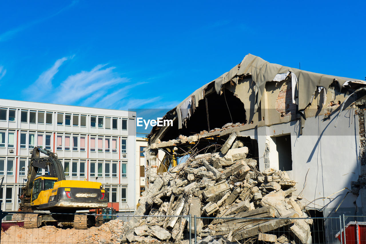 low angle view of old building against blue sky