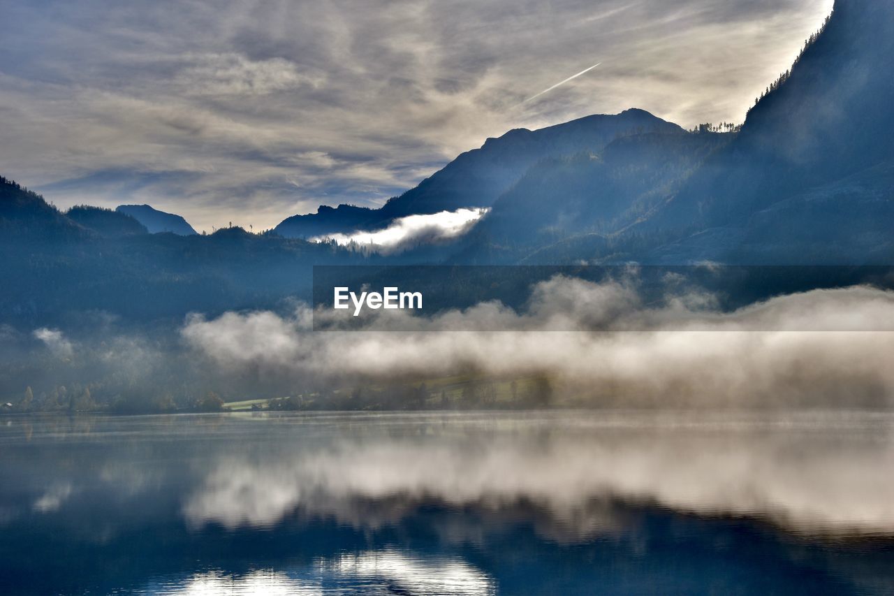scenic view of lake against cloudy sky