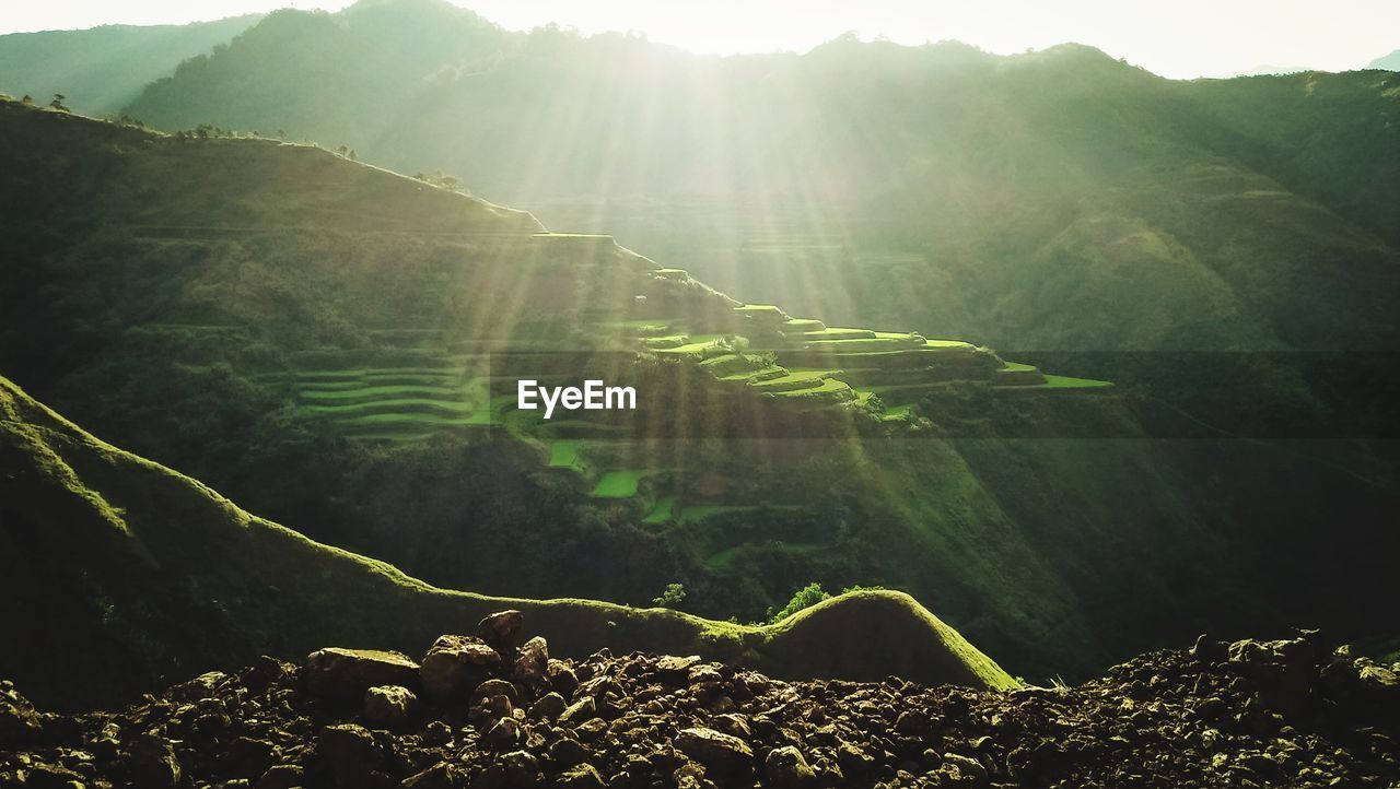 Scenic view of mountains during sunny day