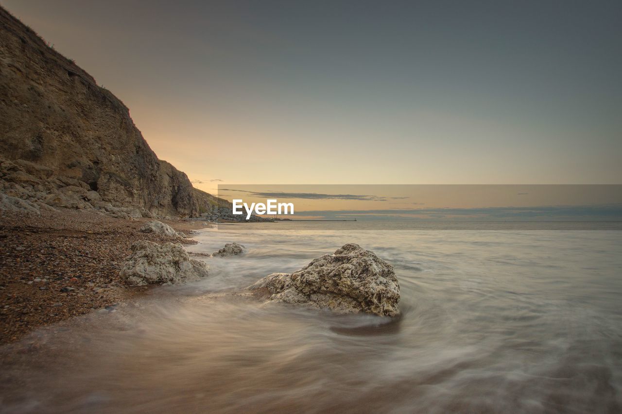 Scenic view of sea against sky during sunset