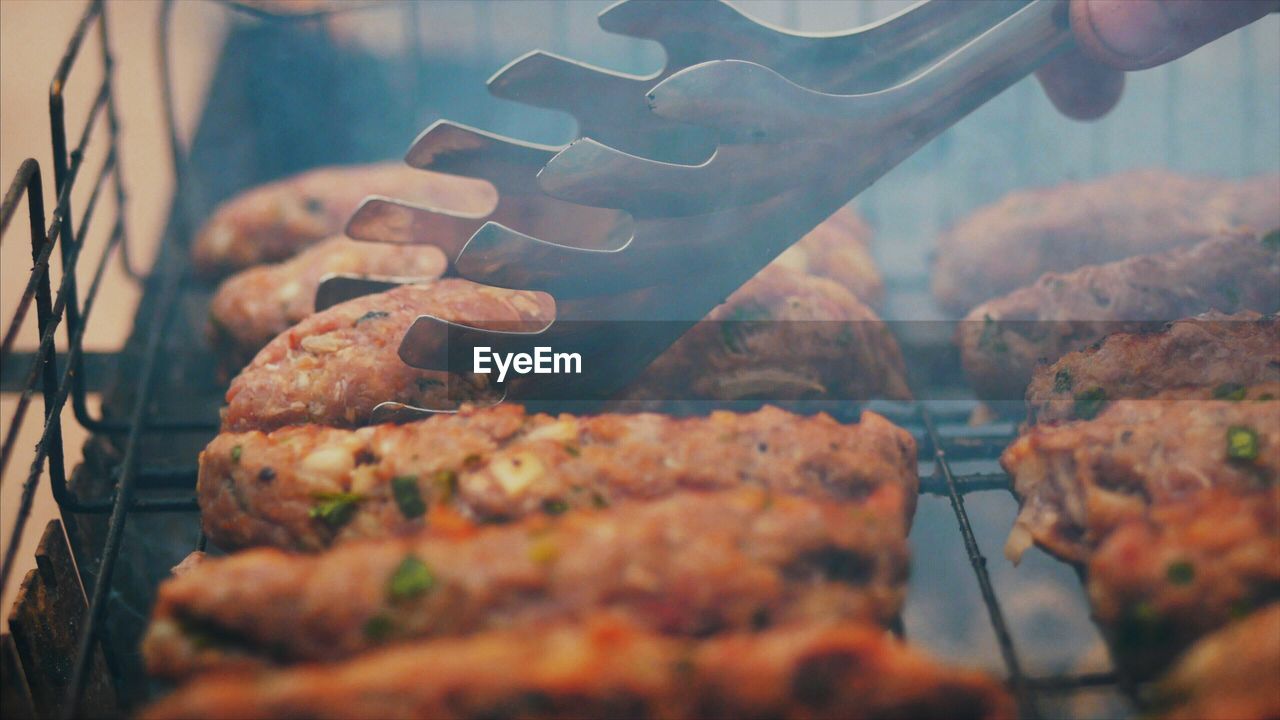 High angle close-up of meat on barbecue grill