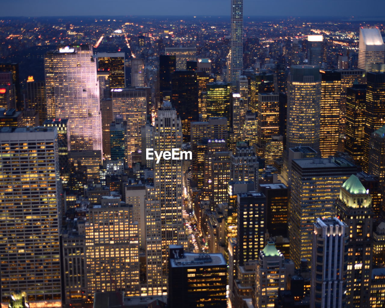 Aerial view of illuminated cityscape at night