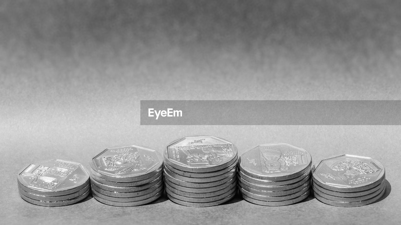 Stack of coins on table