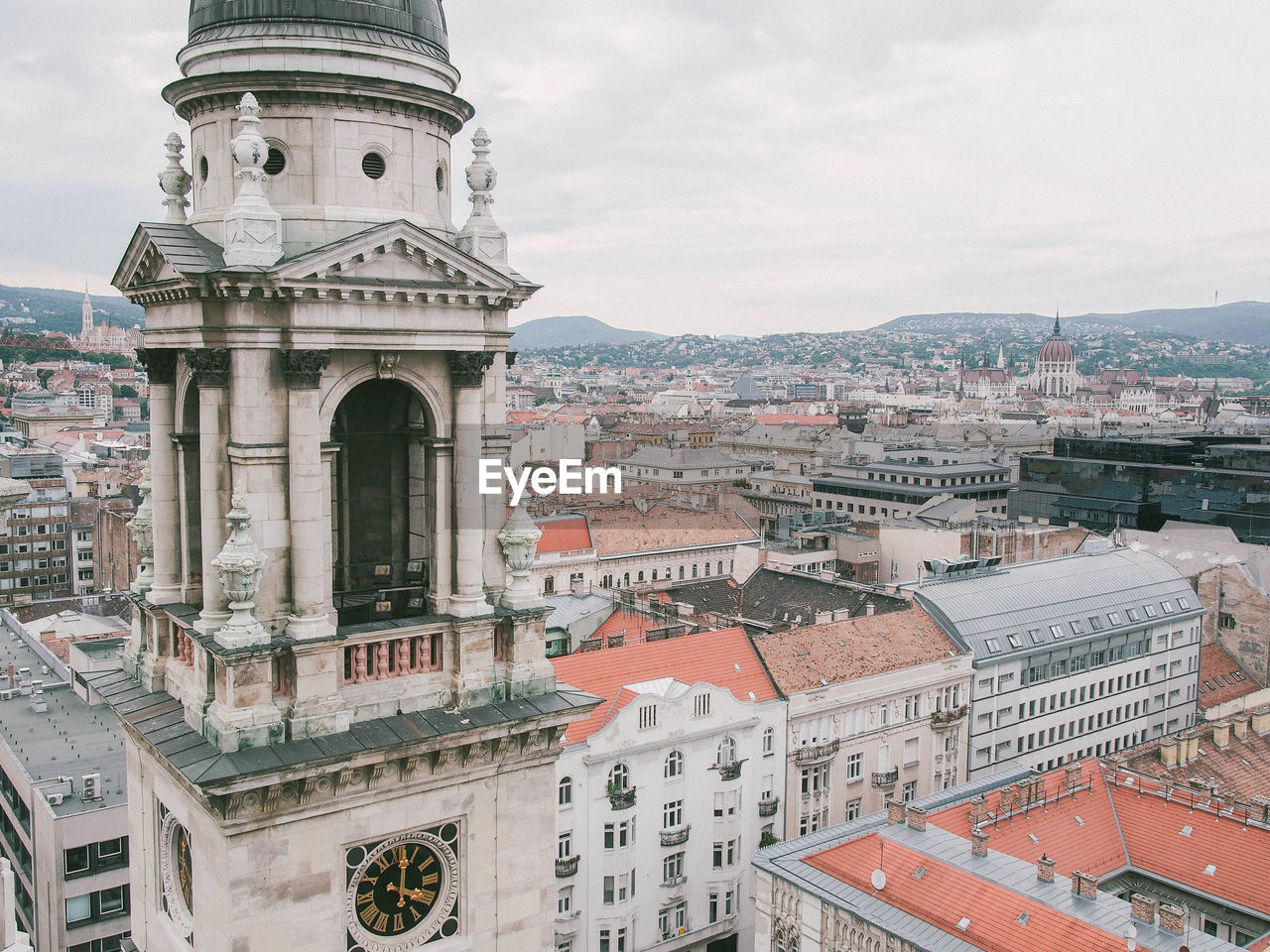 Clock tower of st stephen basilica against cityscape
