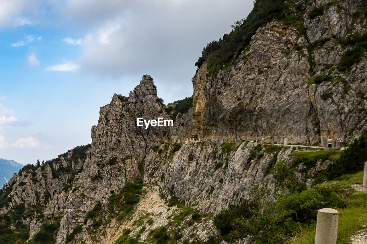 Low angle view of rock formations against sky