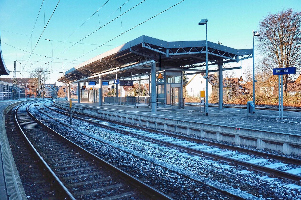 RAILROAD STATION AGAINST SKY