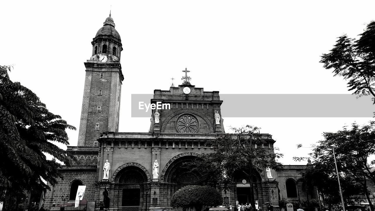 Low angle view of clock tower against sky