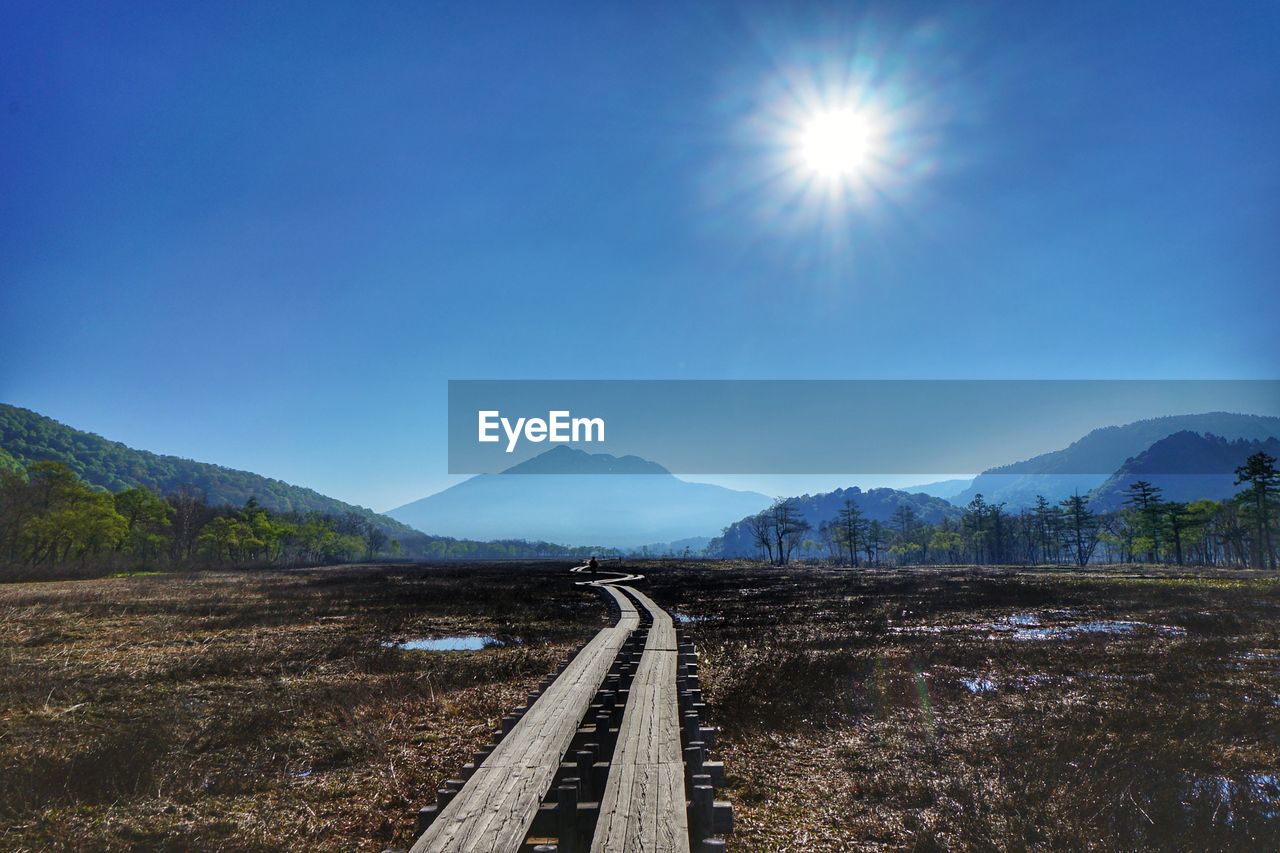 RAILROAD TRACK AGAINST SKY