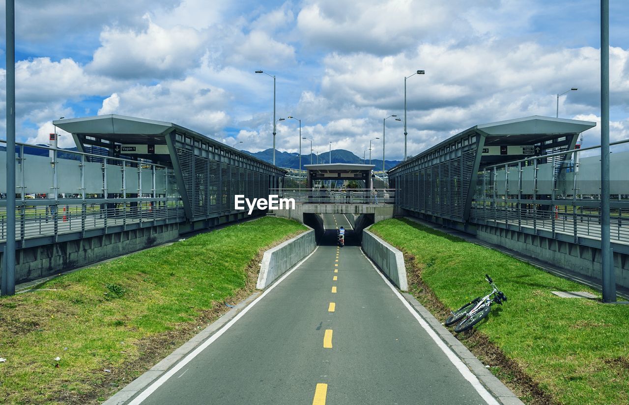 Road between railroad station platforms