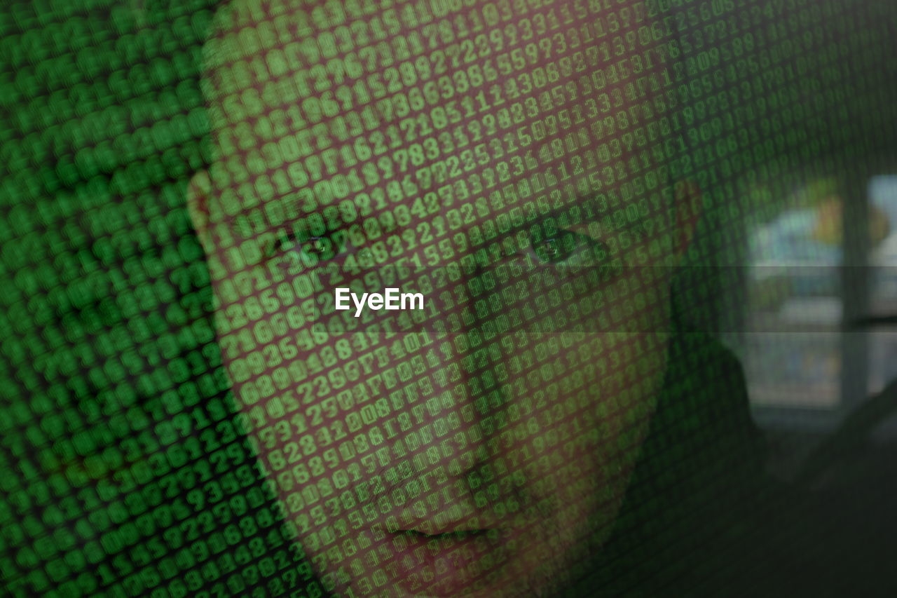 Close-up portrait of man with coding