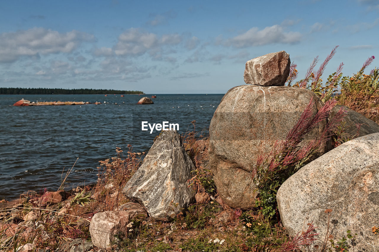 A pile of large rocks by the sea at the fishing harbour of kalajoki, finland. 