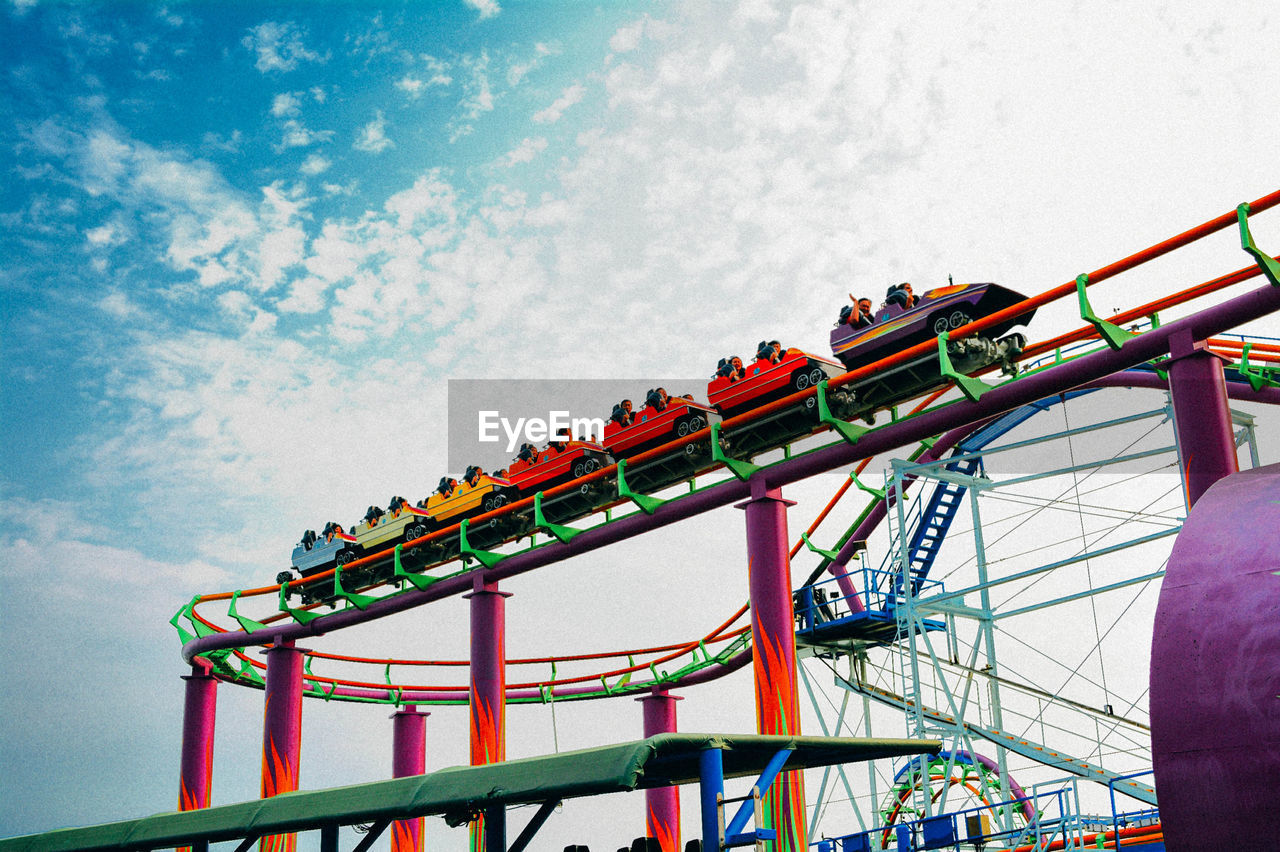 Low angle view of rollercoaster against sky