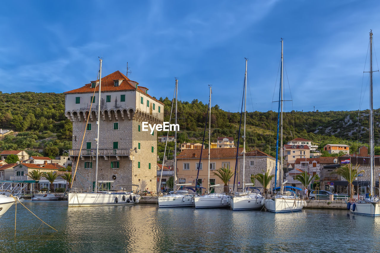 Quadrangular tower in port of marina town, croatia