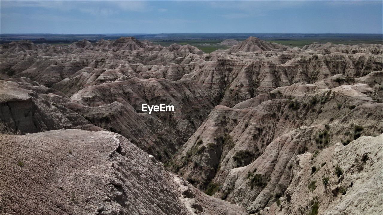 SCENIC VIEW OF ROCKS AGAINST SKY