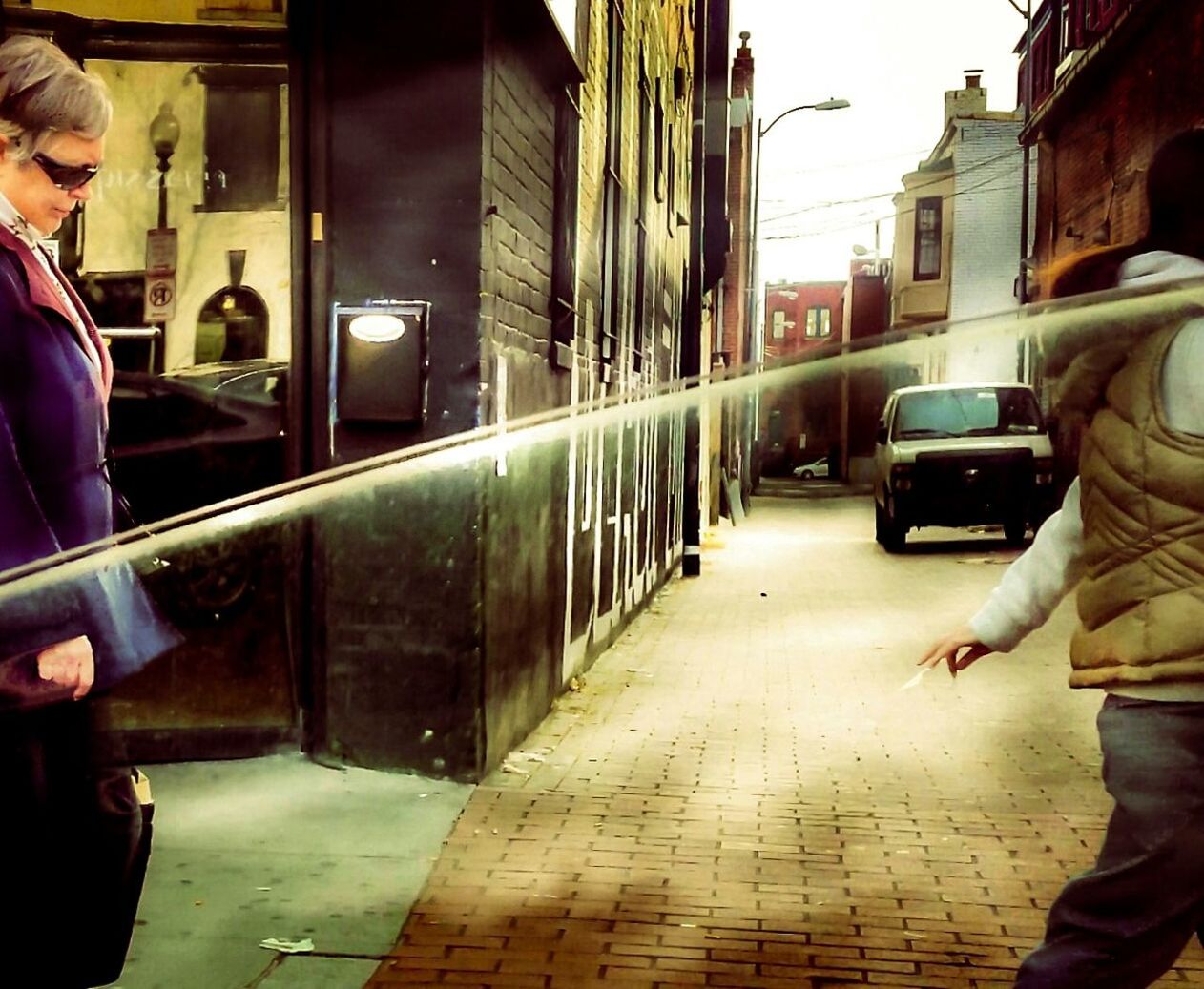 WOMAN STANDING ON FOOTPATH