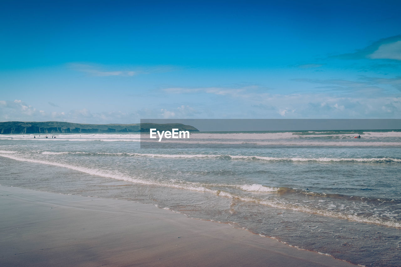 Scenic view of sea against blue sky