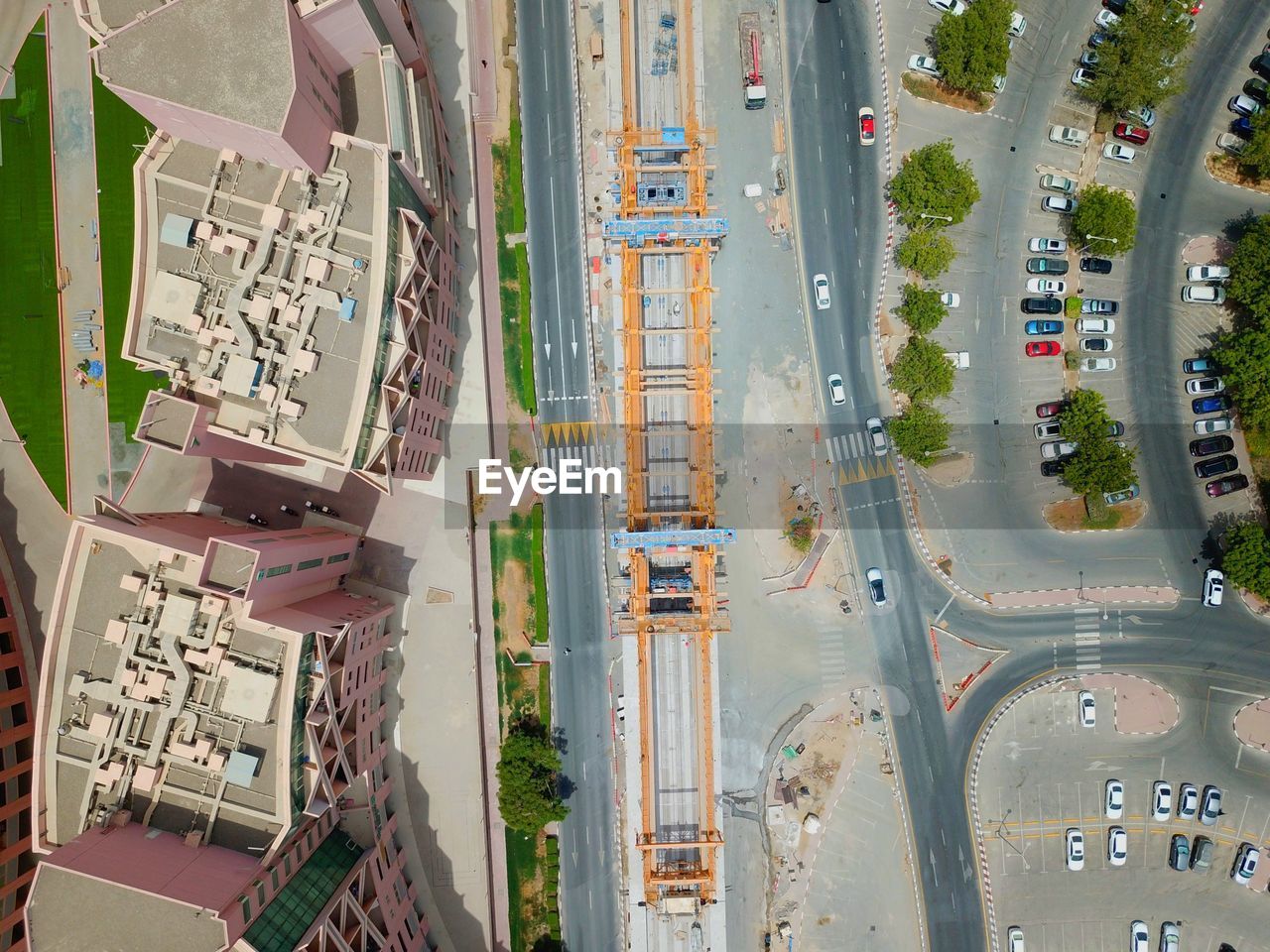 Aerial view of street by buildings in city