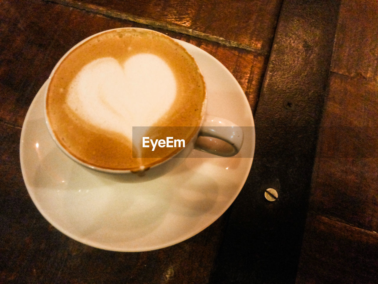 CLOSE-UP OF COFFEE CUP ON TABLE