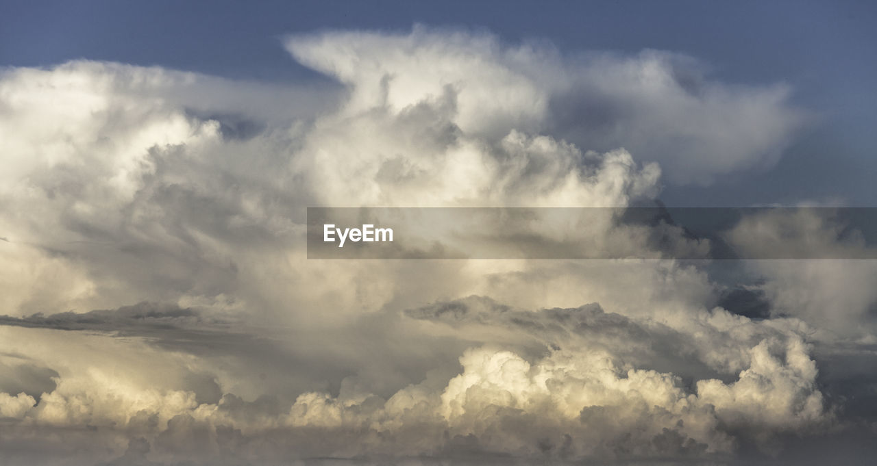 sky, cloud, environment, beauty in nature, nature, cloudscape, storm, scenics - nature, dramatic sky, no people, storm cloud, outdoors, landscape, horizon, thunderstorm, wind, backgrounds, blue, sunlight, day, tranquility, panoramic, overcast, rain, wet, atmosphere, water, awe, idyllic