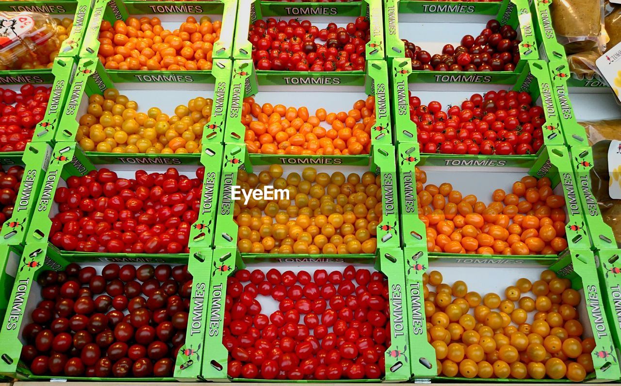 High angle view of tomatoes displayed for sale