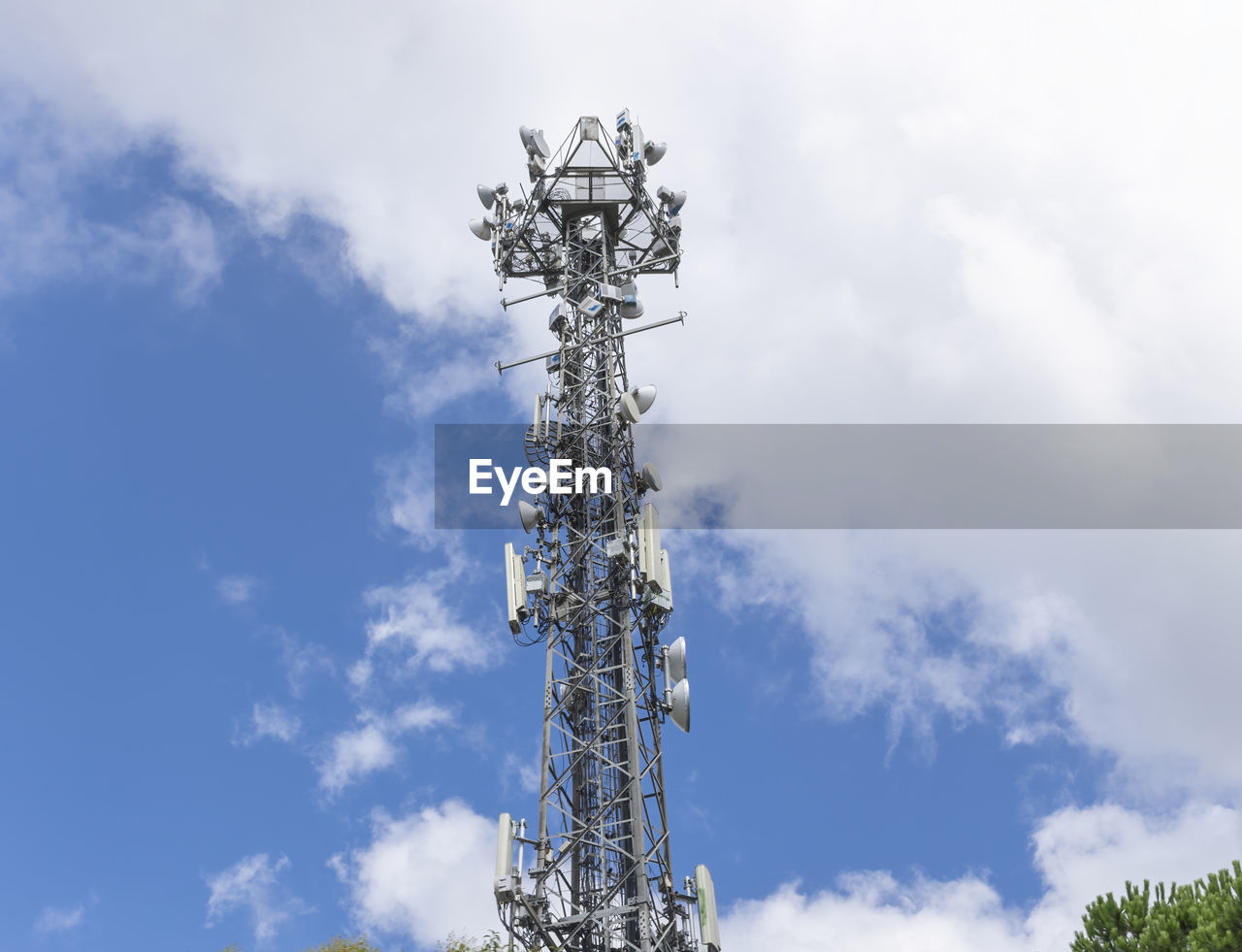 Broadcasting and gsm operators antennas on the high pylon front of bright sky
