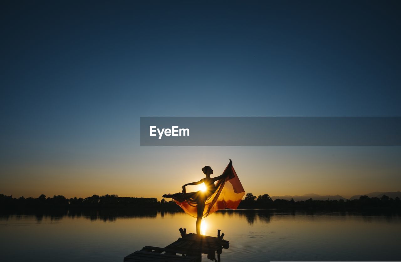 Woman dancing on the lake