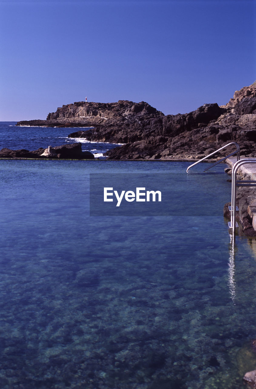 View of infinity pool on beach