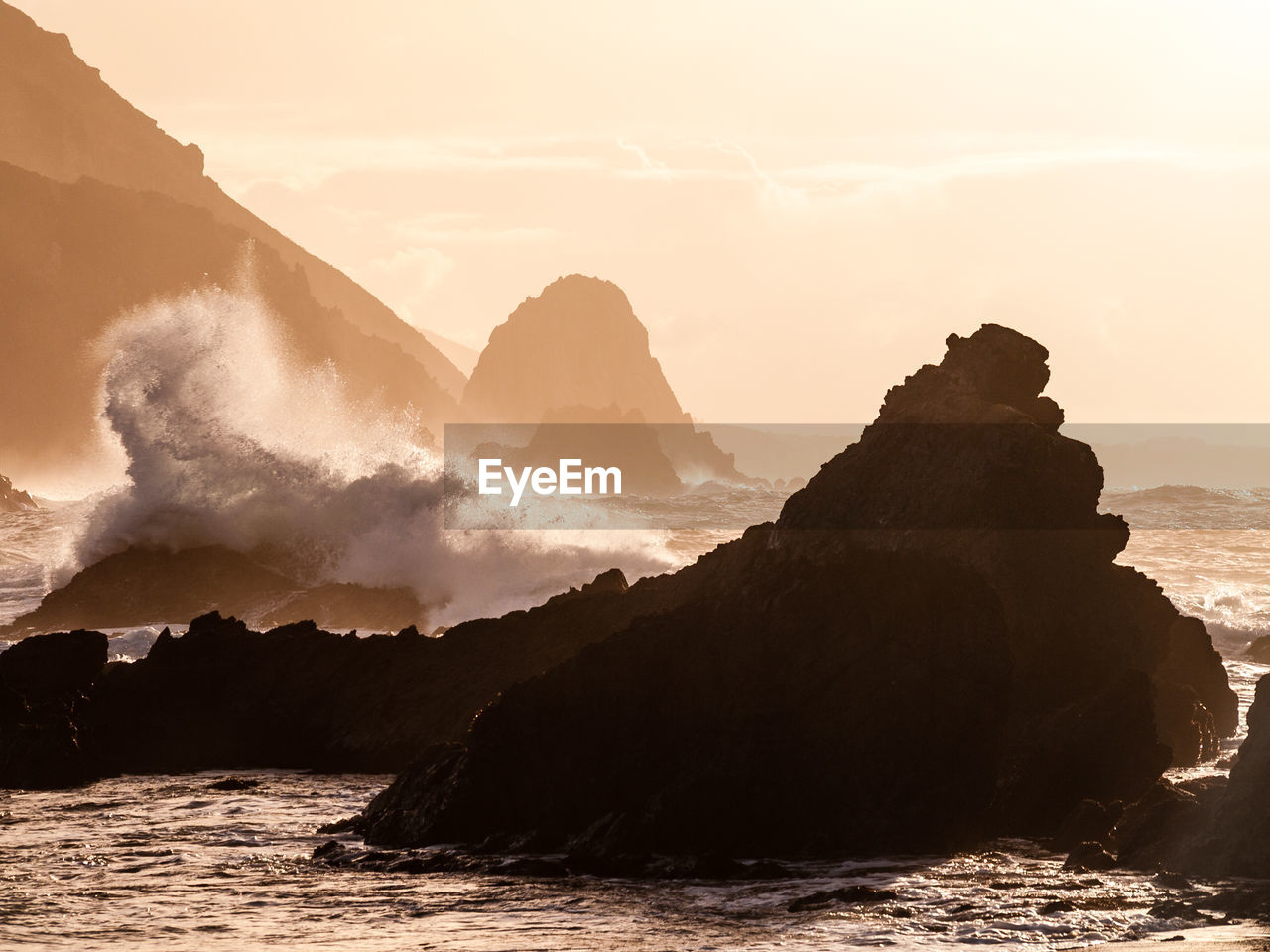 coast, wave, water, ocean, sea, land, rock, beauty in nature, sky, scenics - nature, nature, environment, sunset, mountain, shore, landscape, horizon, beach, travel, travel destinations, no people, wind wave, outdoors, rock formation, tranquility, cloud, sun, bay, dawn, sunlight, cliff, silhouette, terrain, motion, tranquil scene, sand