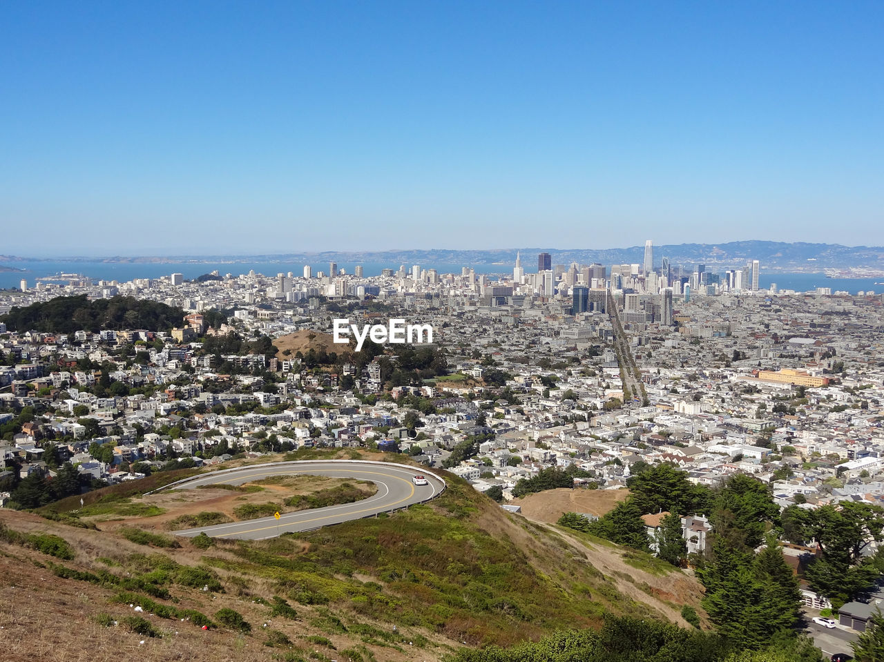 High angle view of townscape against clear blue sky