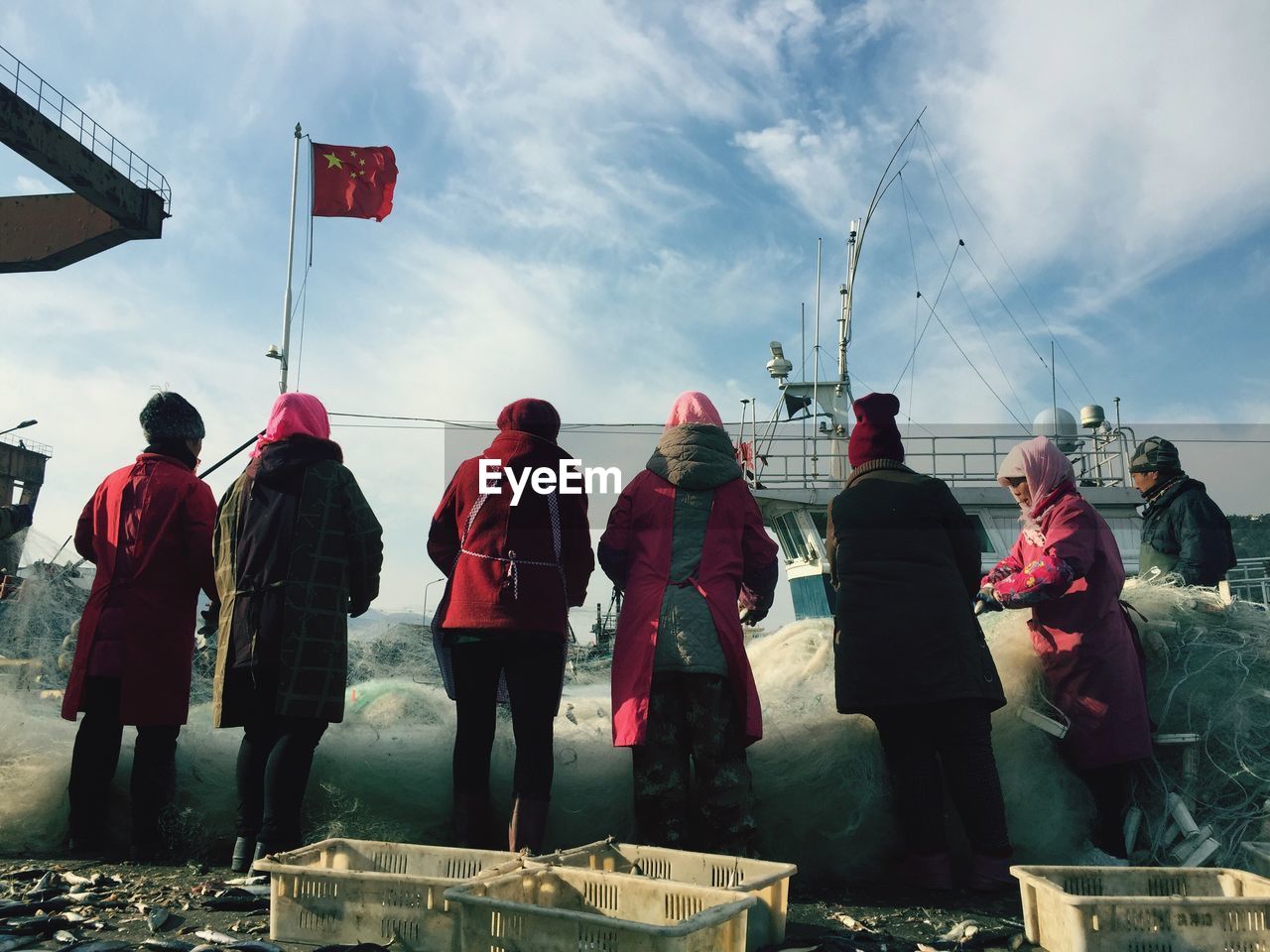 People fishing at harbor