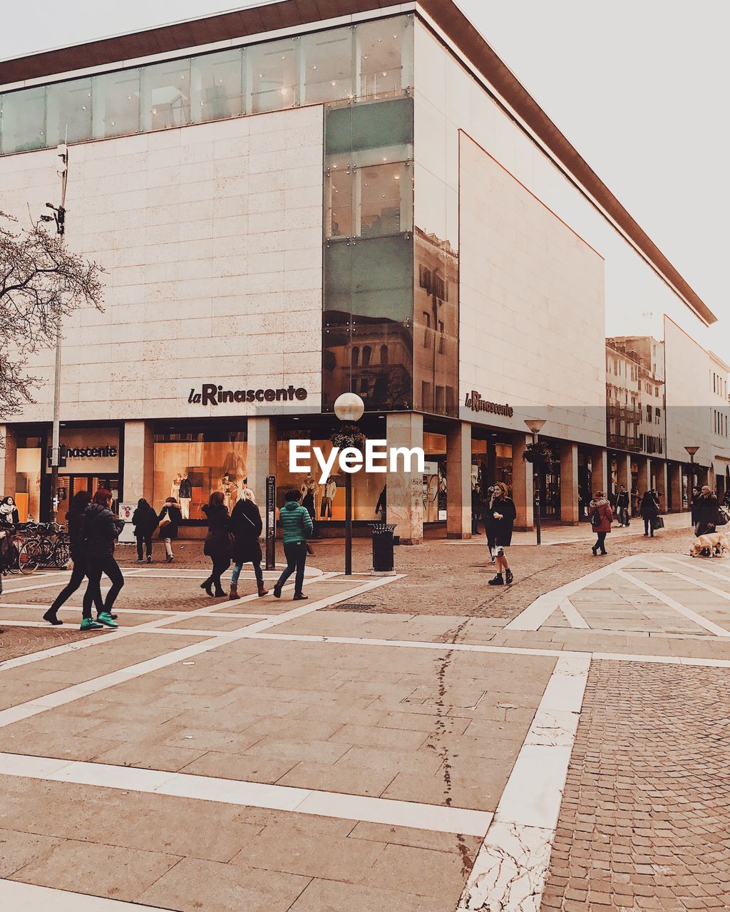 GROUP OF PEOPLE WALKING ON STREET