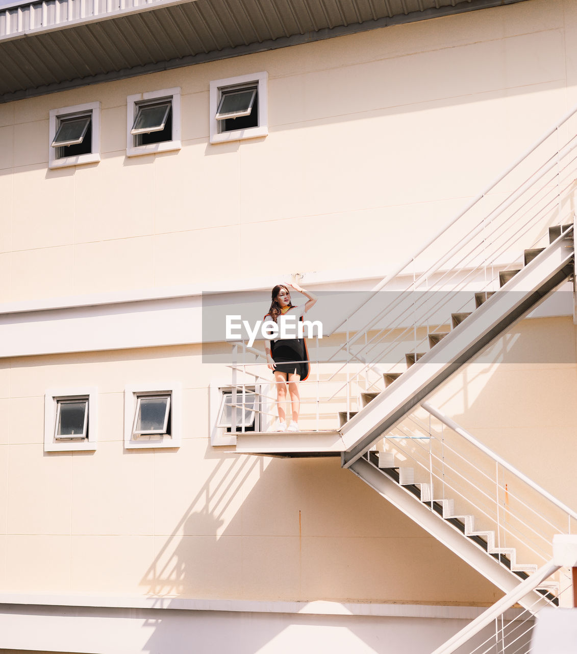 Woman standing on staircase