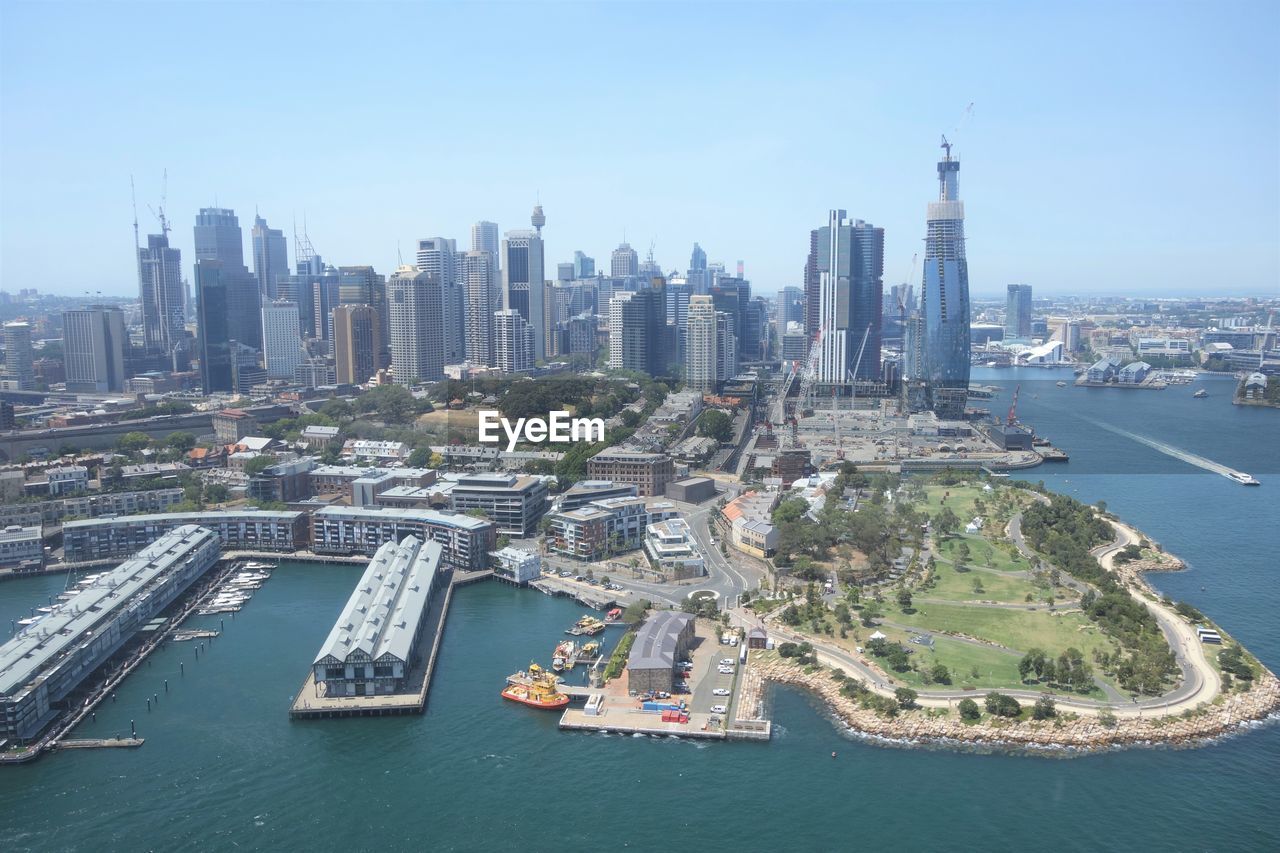 HIGH ANGLE VIEW OF CITY AT SEASIDE