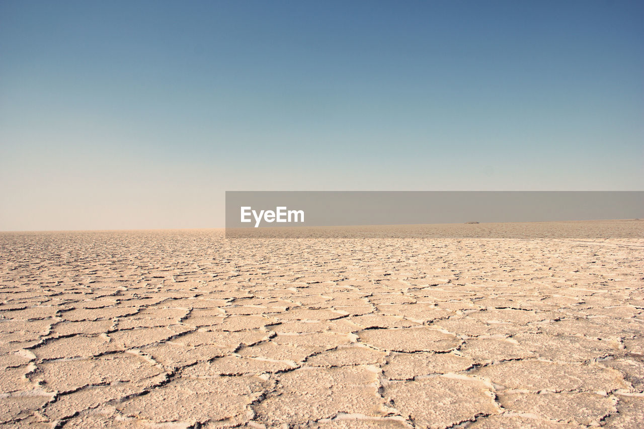 Scenic view of desert against clear sky