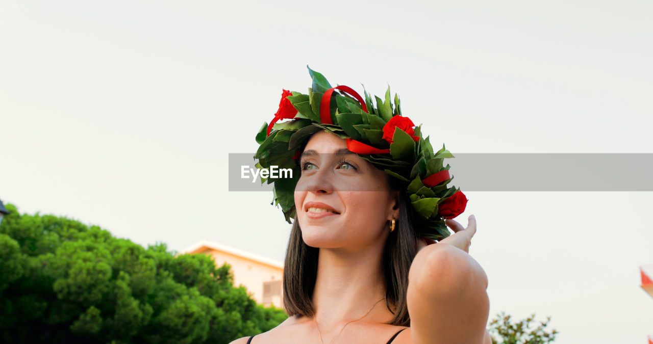 Girl with laurel wreath on her head symbol of graduation in the italian university