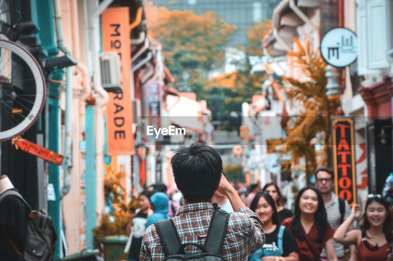 PEOPLE ON STREET IN CITY