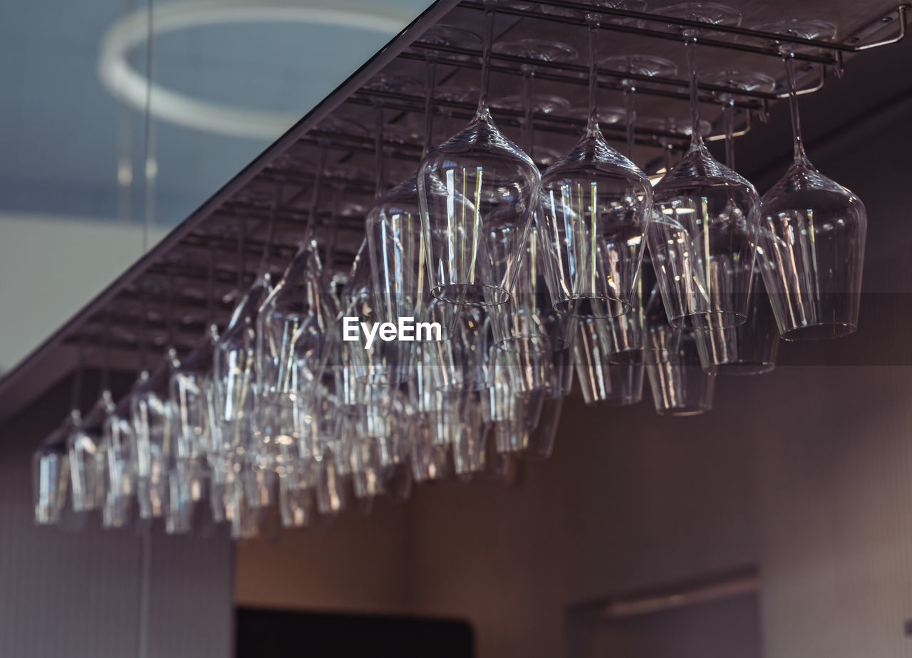 lighting, light fixture, chandelier, light, hanging, ceiling, no people, indoors, iron, focus on foreground, in a row, close-up, lighting equipment, interior design, low angle view, architecture