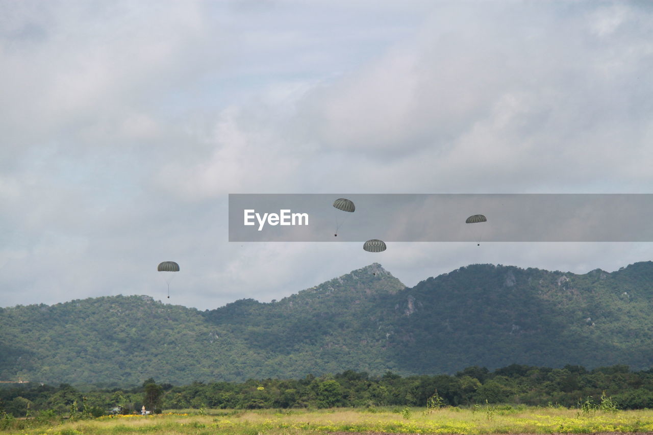 HOT AIR BALLOON FLYING OVER LAND