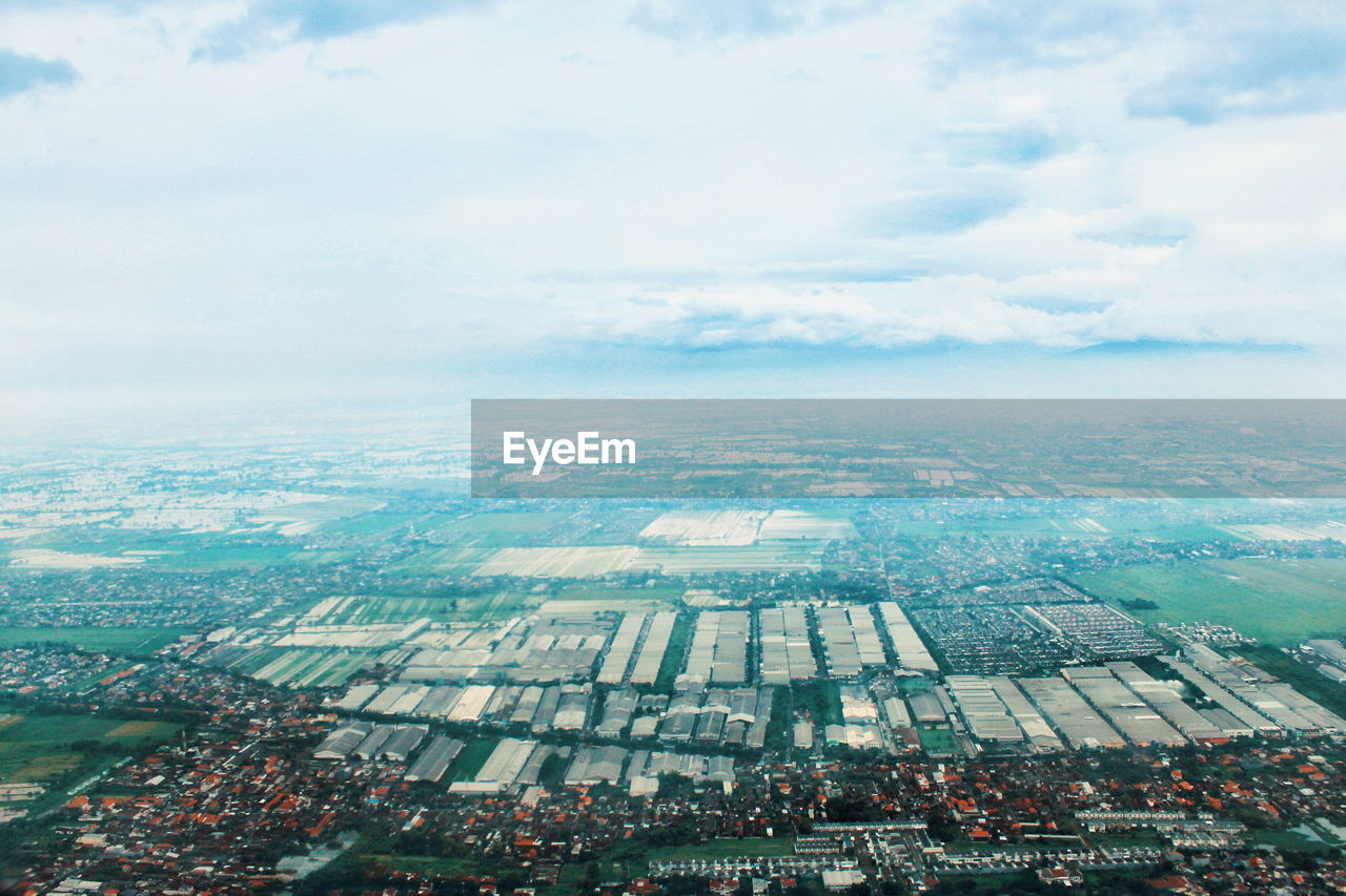 High angle view of buildings in city against sky