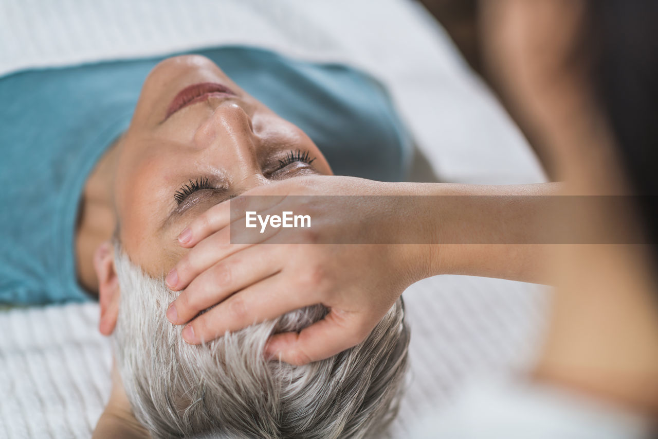 Close-up of woman getting massage at spa