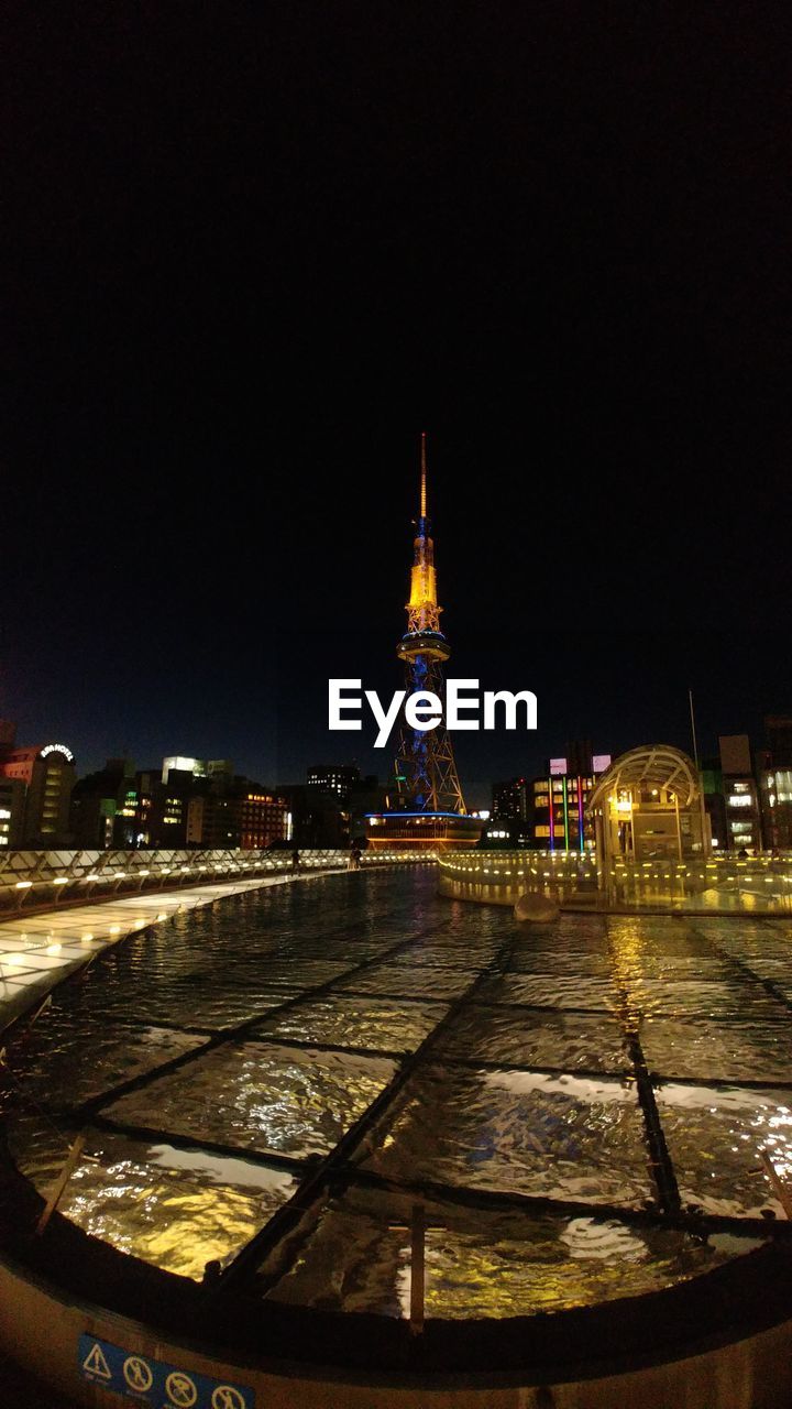 Illuminated buildings in city at night