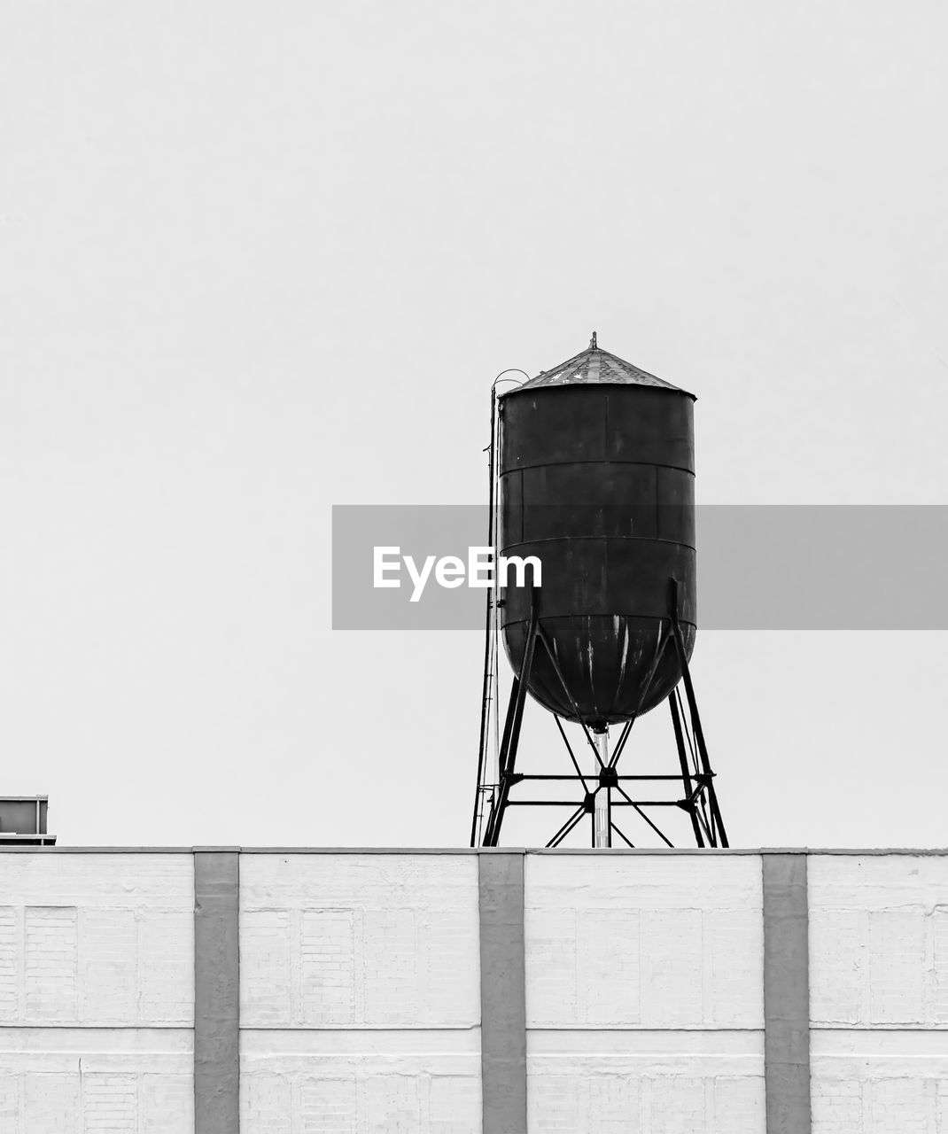 architecture, built structure, white, building exterior, no people, sky, black, storage tank, day, black and white, nature, copy space, clear sky, monochrome, water tower - storage tank, water tower, wall - building feature, monochrome photography, outdoors, railing, lighting