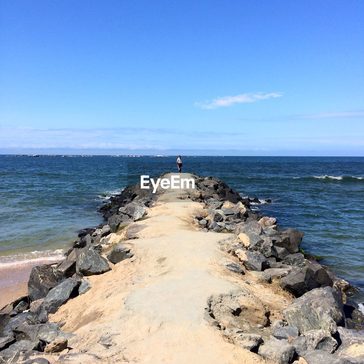 Scenic view of sea against blue sky