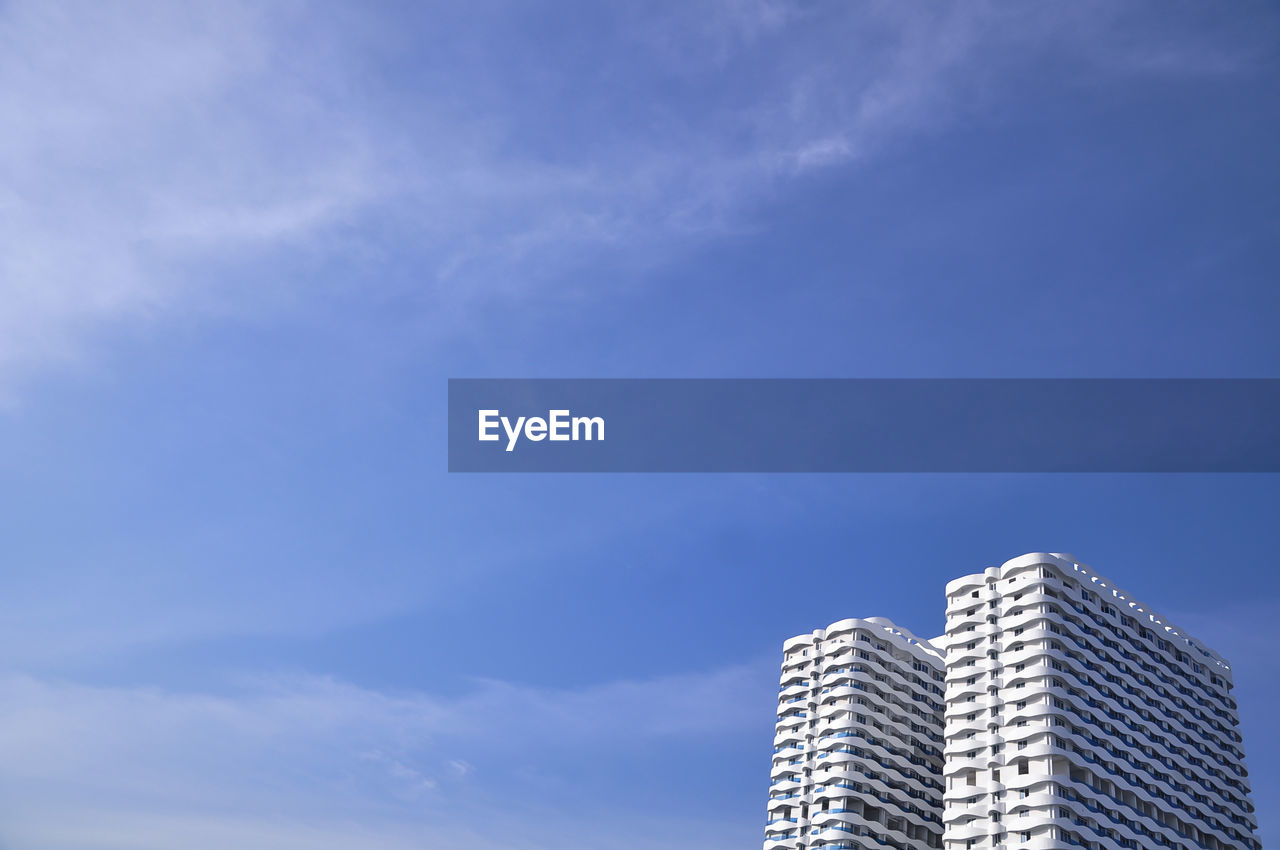 Low angle view of modern buildings against sky