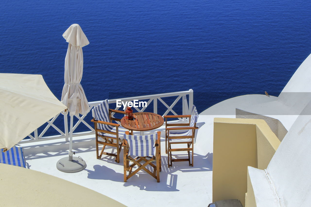 View from a balcony oia village in the caldera by day, greece