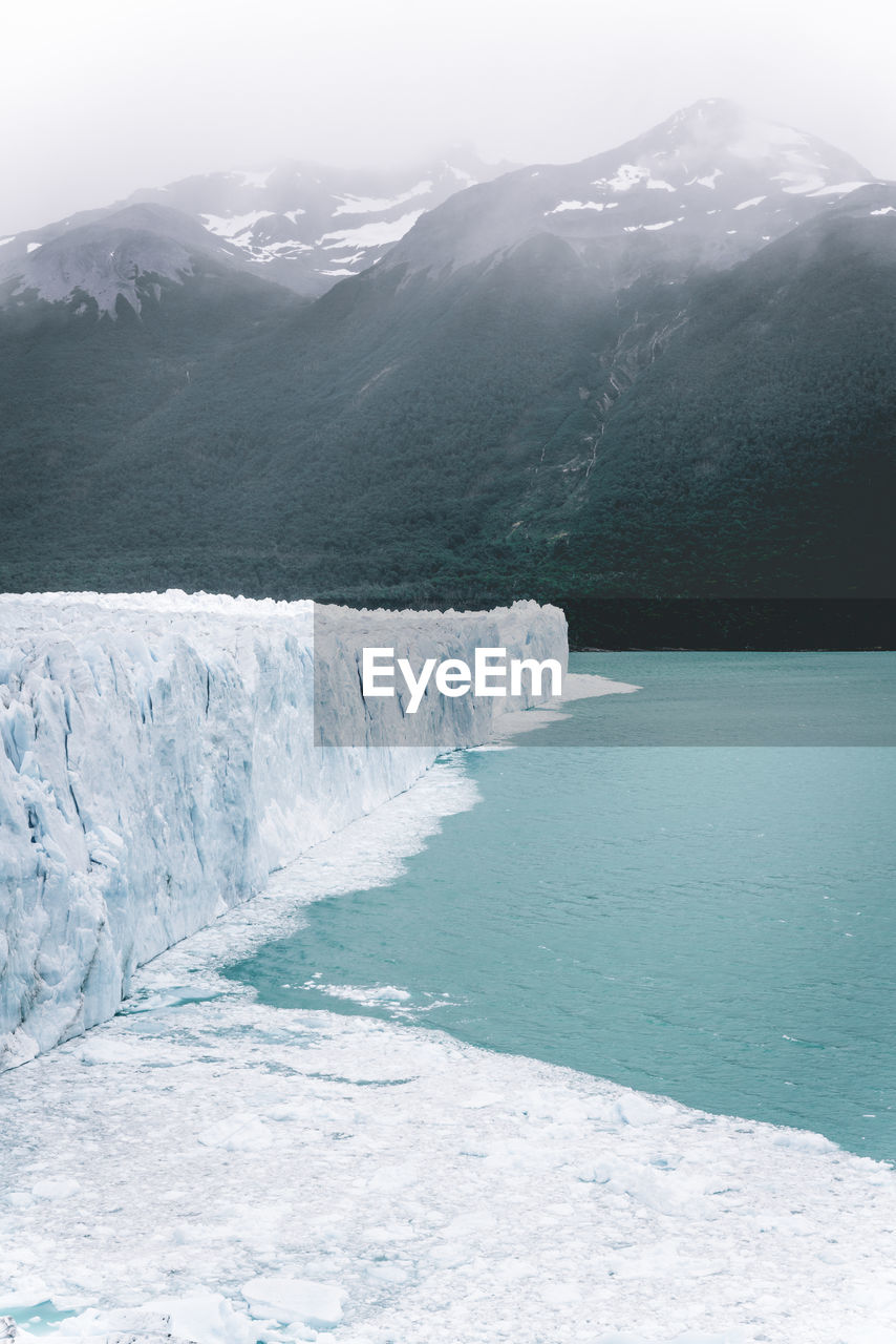 Scenic view of front of perito moreno glacier above water