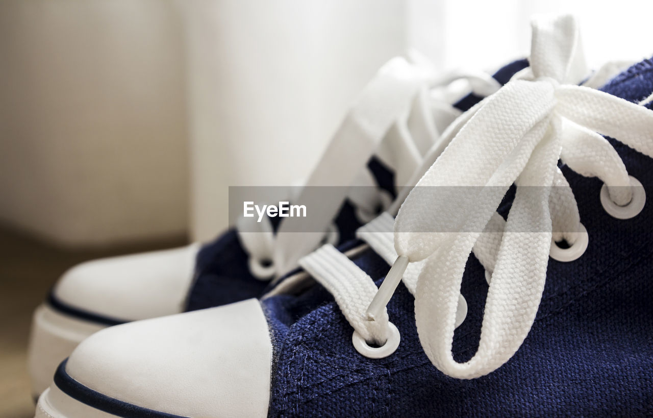 Close-up of shoes on floor at home