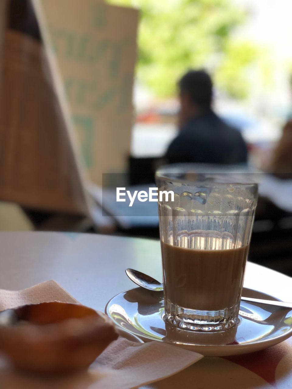 CLOSE-UP OF COFFEE CUP ON TABLE