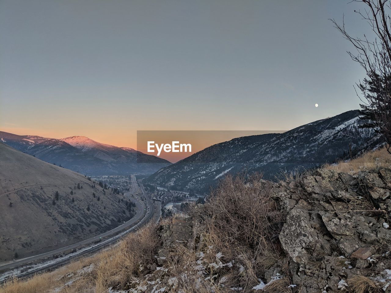 Scenic view of snowcapped mountains against clear sky