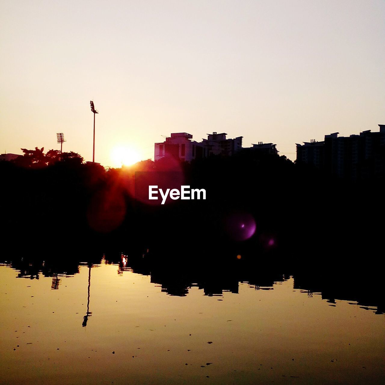 Silhouette of cityscape against clear sky